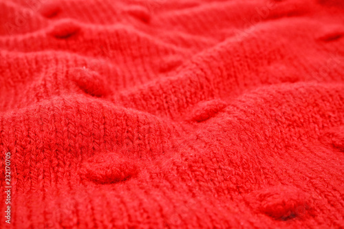 Texture of cozy warm sweater as background, closeup