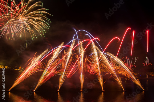 Orange , purple, red and gold fireworks during a firework festival in Malta, 2018