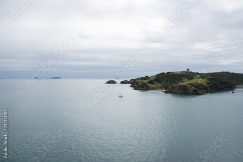 View from Waiheke Island looking at the Hauraki Gulf, Auckland, New Zealand on a grey and cloudy day photo