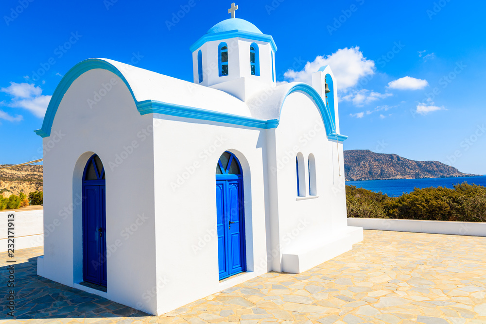 White chapel on sea coast in Ammopi village, Karpathos island, Greece