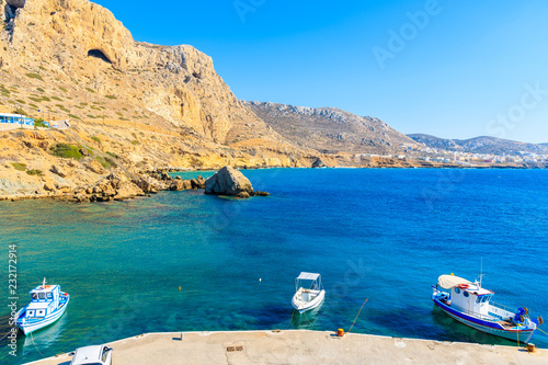 Fishing boats on turquoise sea water in Finiki port, Karpathos island, Greece © pkazmierczak