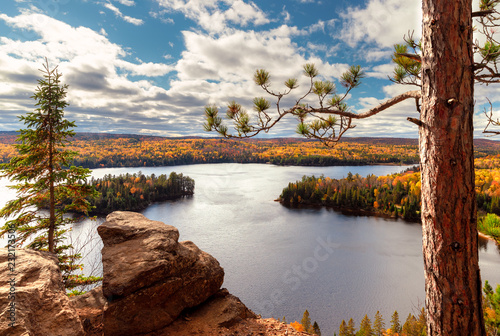 View over Fall forest and lake with colorful trees from above in Algonquin Park, Canada photo