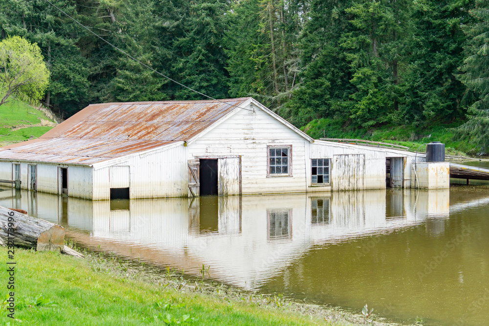 Flooded farm building Flooded farm building