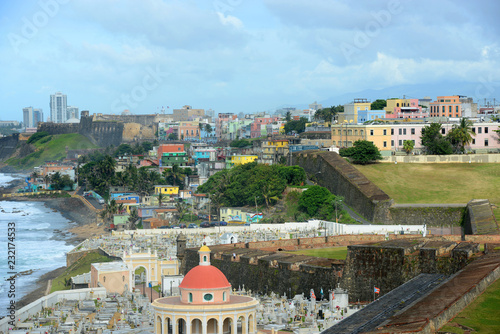Old San Juan City Skyline and Santa Maria Magdalena de Pazzis Cemetery, from Castillo San Felipe del Morro El Morro, San Juan, Puerto Rico. This Castle is designated as UNESCO World Heritage Site. photo