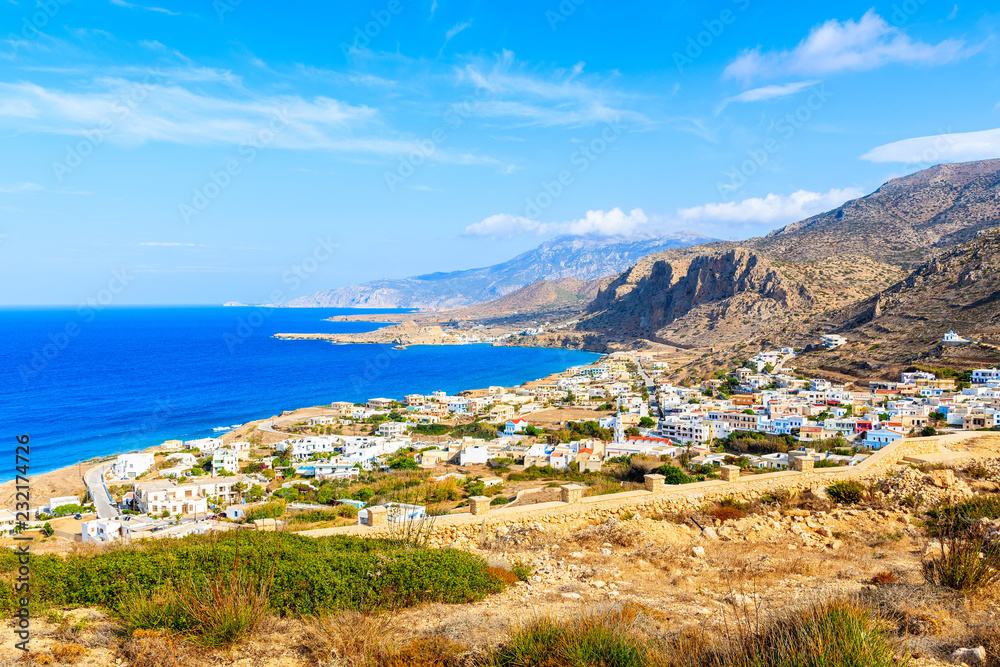 View of beautiful sea coast with mountains and Arkasa village on Karpathos island, Greece