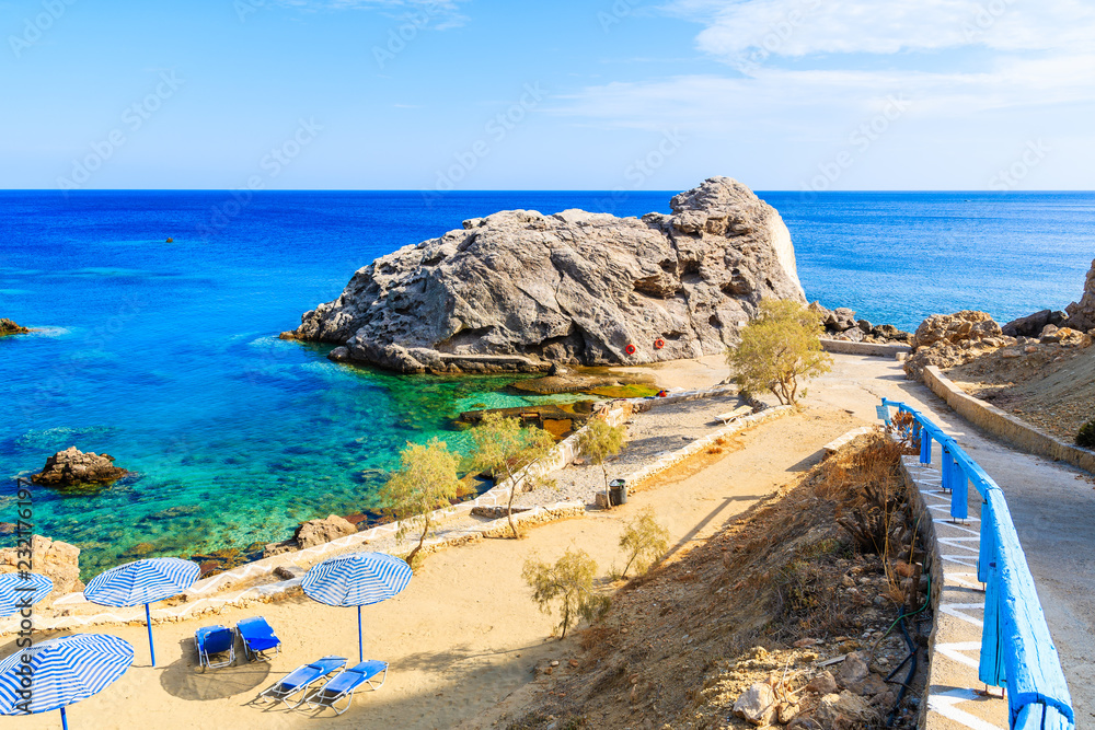 Beautiful bay with beach in Ammopi village on sea coast of Karpathos island, Greece - obrazy, fototapety, plakaty 