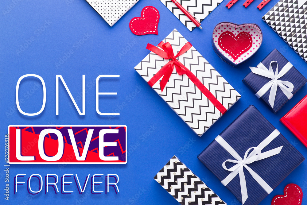 Person holding a present for Saint Valentine's day in his hands. Beautiful colorful background to st. Valentine day. Greeting card with red hearts. Wedding's invitation. Love expression. Person holding a present for Saint Valentine's day in his hands. Beautiful colorful background to st. Valentine day. Greeting card with red hearts. Wedding's invitation. Love expression.