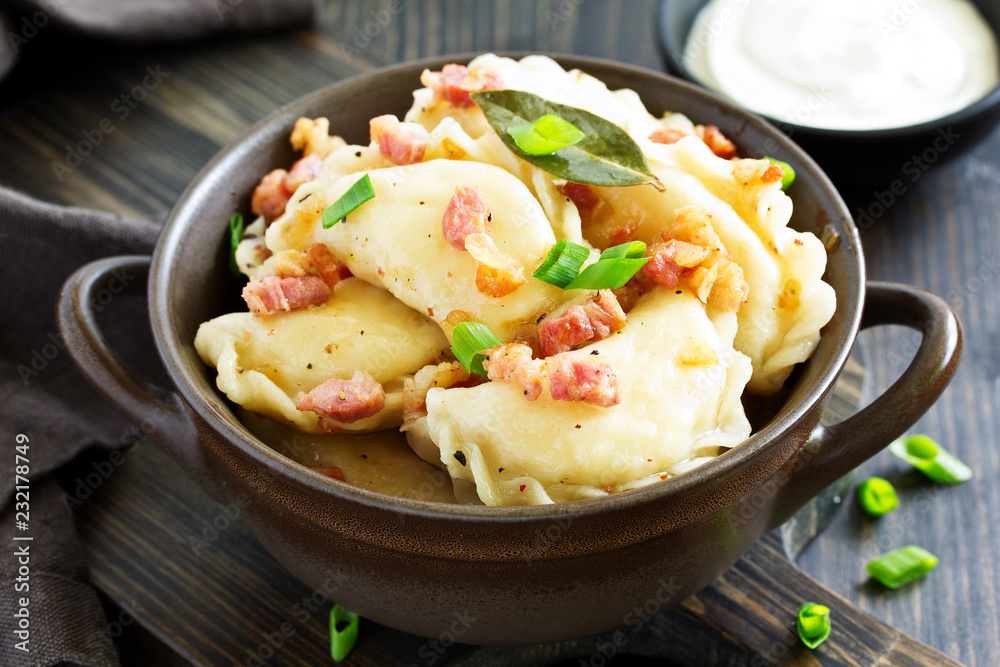 dumplings with potatoes in onion and bacon sauce. Varenyky, vareniki, pierogi, pyrohy. dumplings with potatoes in onion and bacon sauce. Varenyky, vareniki, pierogi, pyrohy.