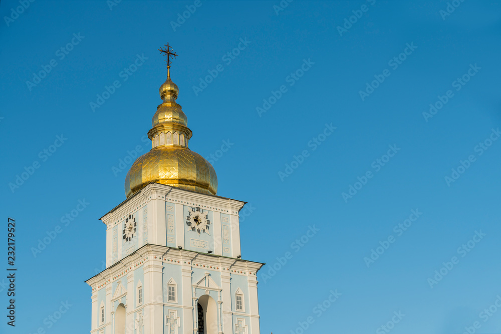 Bell tower of an ancient orthodox temple on a blue background. Bell tower of an ancient orthodox temple on a blue background.