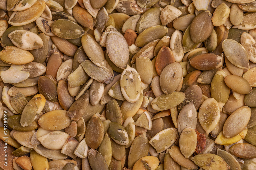 Heap of fresh pumpkin seeds background. Close up Heap of fresh pumpkin seeds background. Close up
