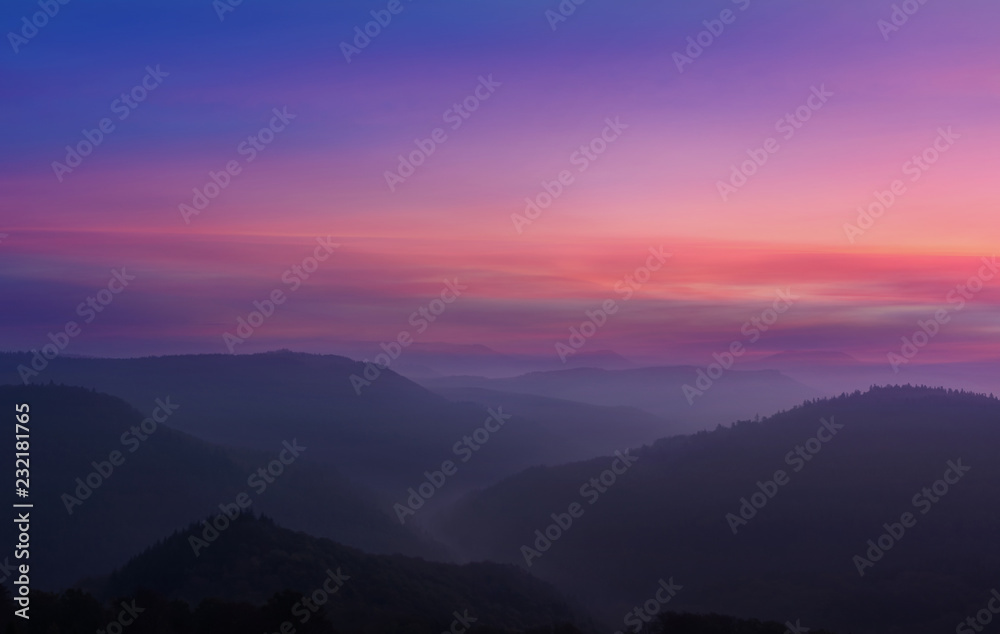 Sunrise in the foggy mountains