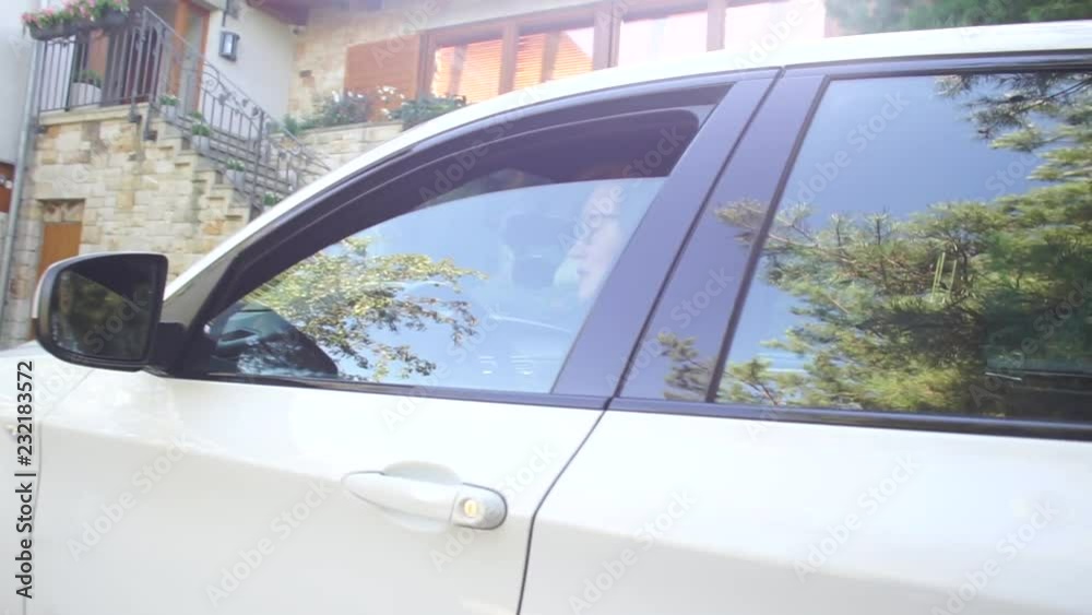 woman looks out of the white car woman looks out of the white car