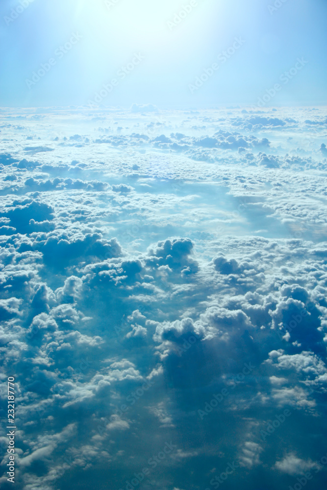 blue sky with white clouds. Flight over clouds. Celestial abyss