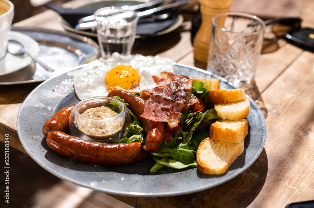 Plate with unhealthy food is on the table Plate with unhealthy food is on the table