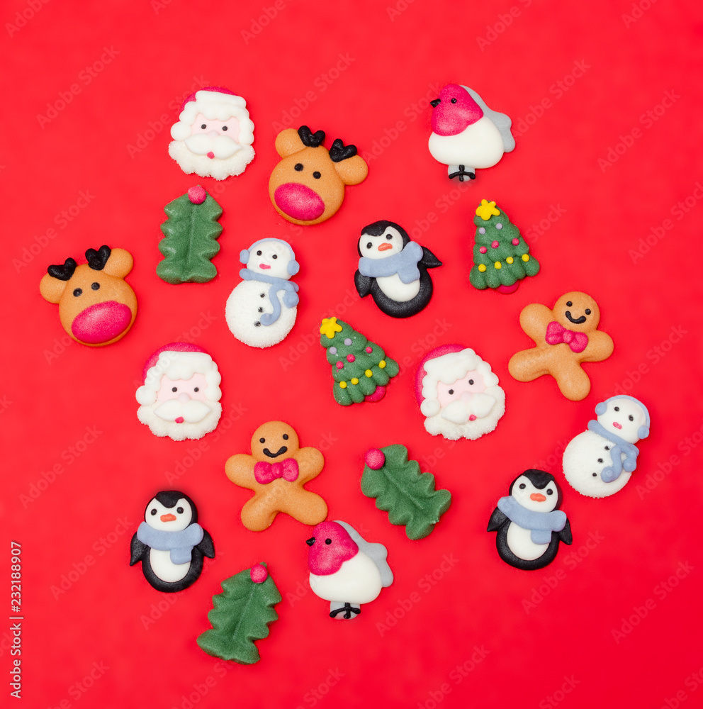 Christmas food decorations.  Christmas symbols. Christmas cookies on red background from above. Desert.