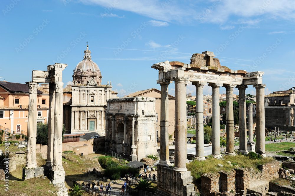Roman Forum in Rome, Italy, It is one of the main tourist attractions of Rome. Panorama of the famous Roman Forum or Foro Romano in a sunny day. Ancient architecture and cityscape of historical Rome.