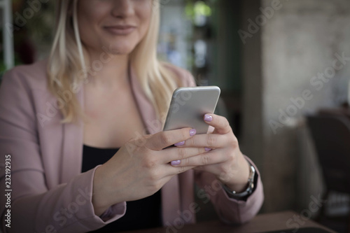 Texting on phone. © Natasa