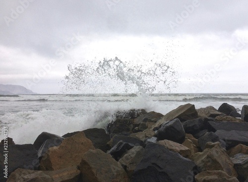 waves crashing on rocks Pacific Ocean