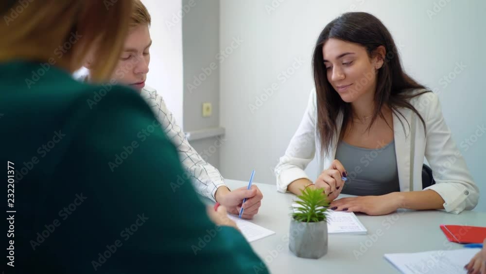 high school student group discussing friendly and solving project assignment at table together. education, practice, learning, knowledge, cooperation, study concept high school student group discussing friendly and solving project assignment at table together. education, practice, learning, knowledge, cooperation, study concept