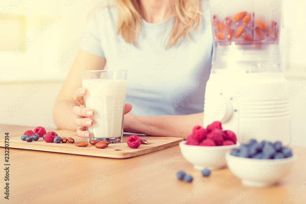 Preparing detox fruits smoothie in blender