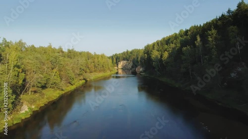 River and Green Forest nature near summer Cesis city in Latvia, Gauya, 4K drone flight landscape from above photo