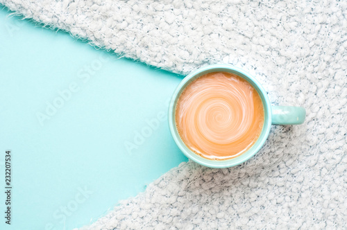 Cup of coffee with milk on a bright background