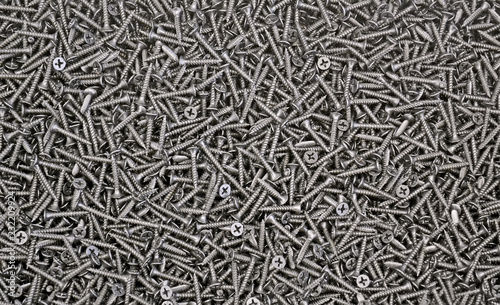 Canvas Print black screws texture background closeup, modern industry diversity