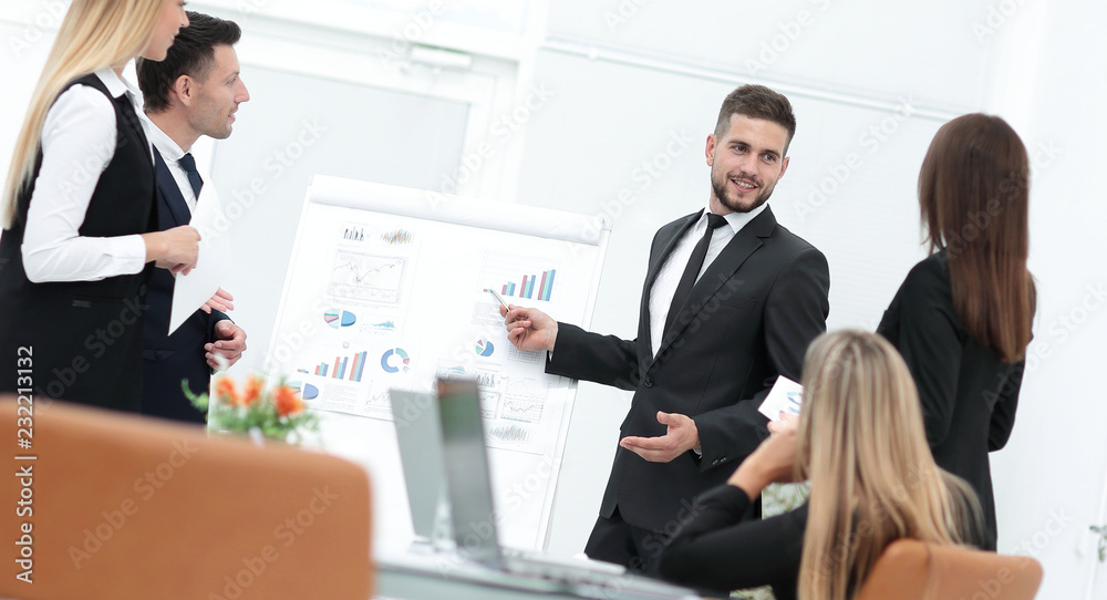 businessman makes a presentation to his business team businessman makes a presentation to his business team