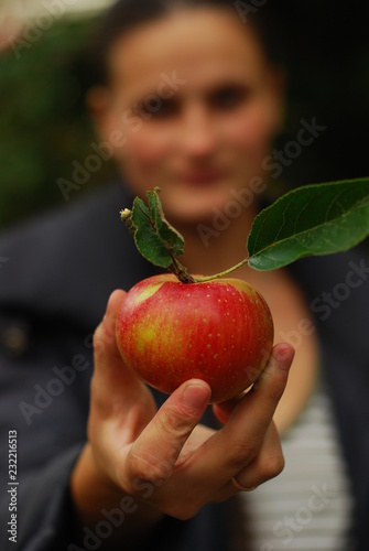 red apple in hand