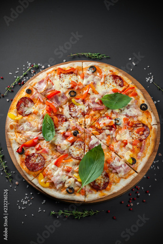 Pizza with sausage and Basil