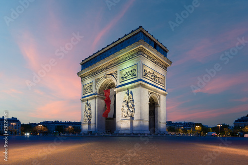 Arc de Triomphe Paris and Champs Elysees with a large France flag flying under the arch in Europe victory day at Paris, France. © ake1150
