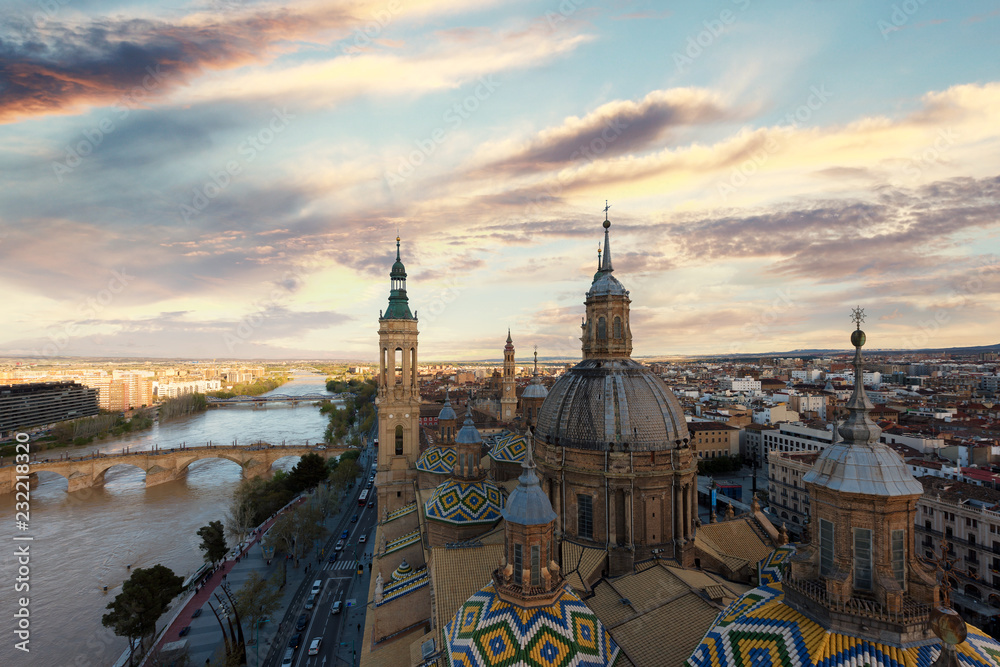 Obraz premium A beautiful view of Zaragoza, in Spain, from one of the towers of the Pilar Basilica near to Ebro river. A huge cathedral near to the river is the most viewed monument in Zaragoza