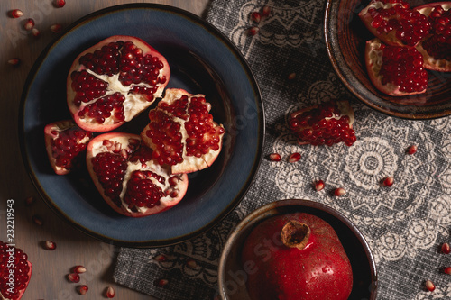 Flat lay of pomegranates in bowl