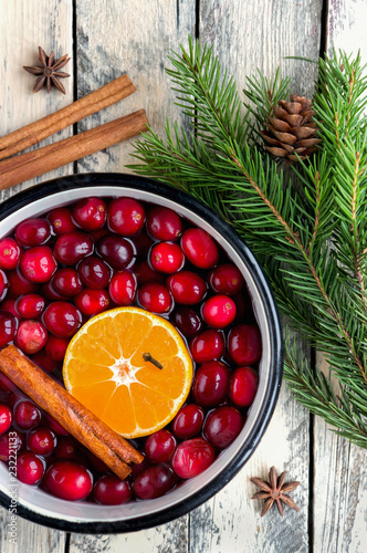 Christmas potpourri. Top view. Hot scented beverage made from cranberry, cinnamon, clementines and spices. 