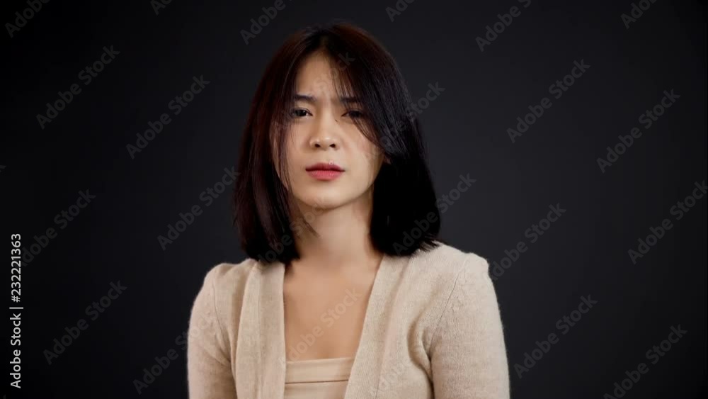 Pretty teenager acting in Feel offended on gray background Pretty teenager acting in Feel offended on gray background