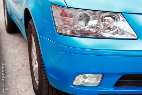 Blue car headlight close-up