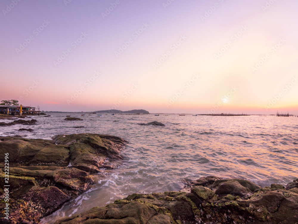Rocks and sea in twilight time of somewhere in Chon Buri province at Thailand RA