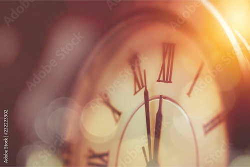 Close-up photo of vintage clock on background