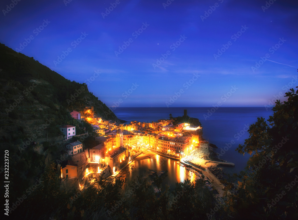 Italian sea village Vernazza in Cinque Terre. Sunset, Five lands, Cinque Terre National Park, Liguria, Italy. Night City Lights.