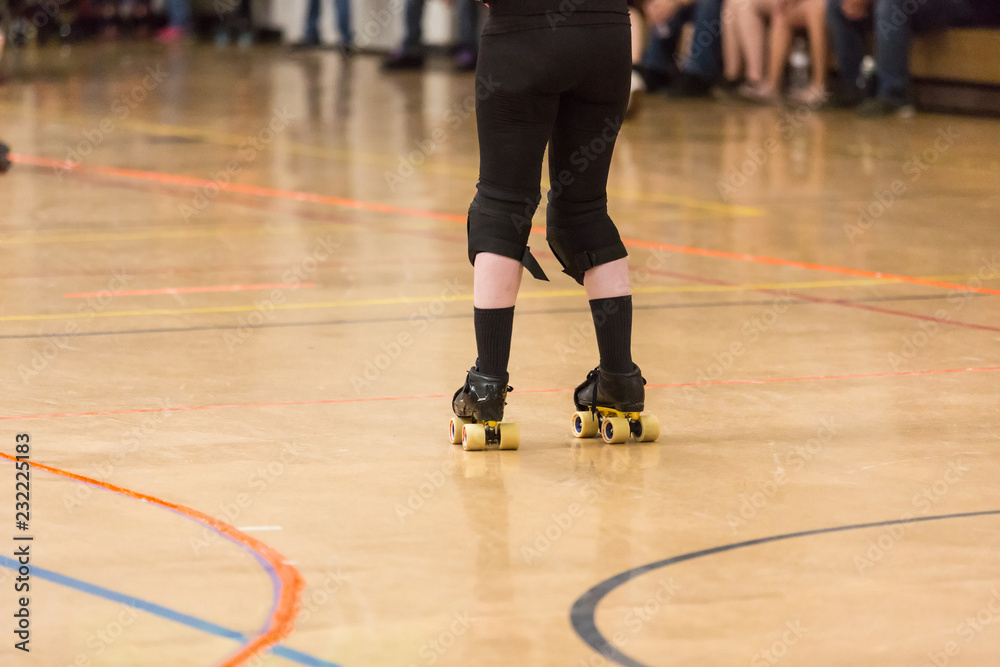 Roller derby players compete against each other Roller derby players compete against each other
