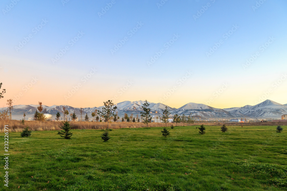 Erzurum from green fields with Palandoken mountain background in Erzurum province, Turkey