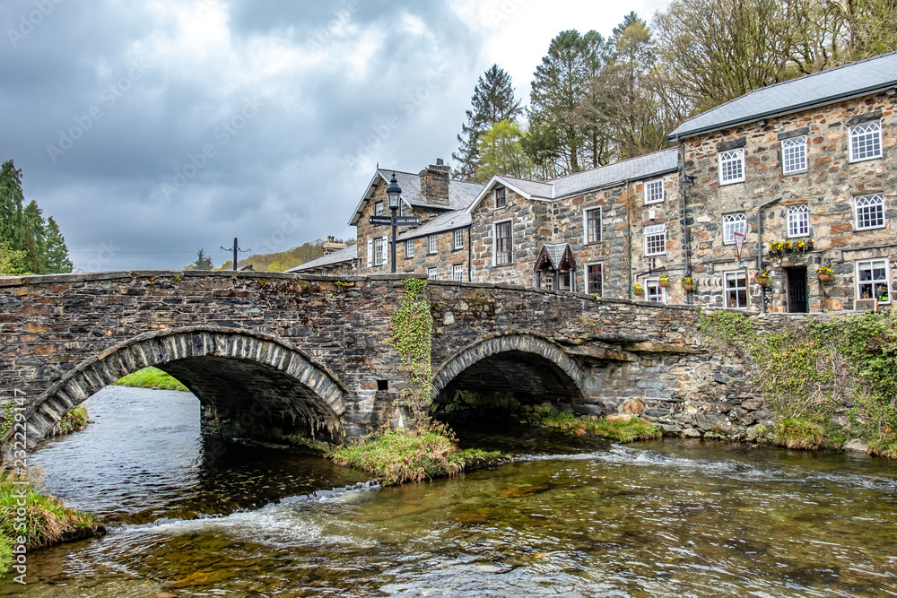 Looking over the River Colwyn to the historic building of Beddgelert in the heart of Snowdonia National Park