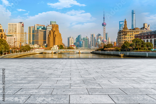 Blue sky, empty marble floor and skyline of Shanghai urban architecture. © 昊 周
