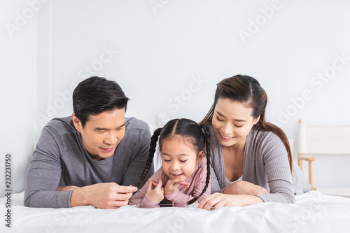 Portrait happy Asian family over white background