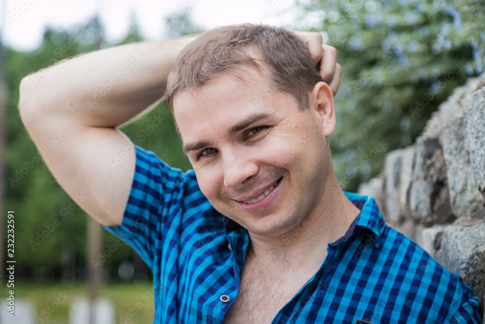 Portrait of handsome young man near stone wall Portrait of handsome young man near stone wall