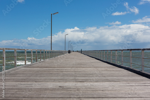 Photos The Semaphore jetty with blue skies and fluffy clouds at Semaphore South Austral
