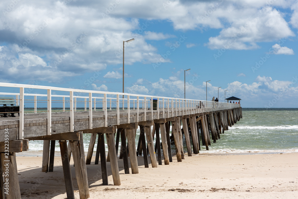The grange jetty with a blue sky and white fluffy clouds at Grange South Australia on 7th November 2018