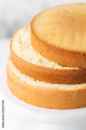 Canvas Print Sponge cake. Shortcakes on a white cake stand, selective focus