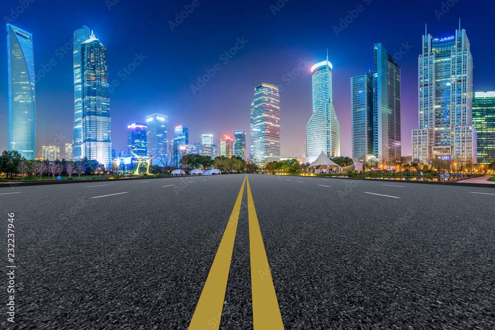 Empty asphalt road along modern commercial buildings in China's cities Empty asphalt road along modern commercial buildings in China's cities