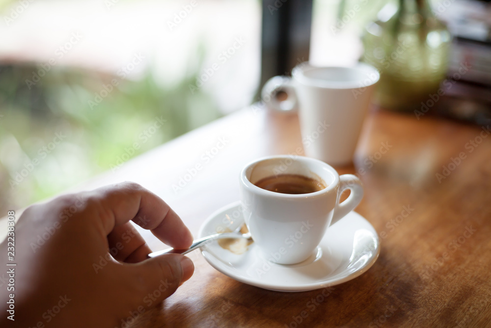 Cup of hot espresso coffee on wooden table. Cup of hot espresso coffee on wooden table.
